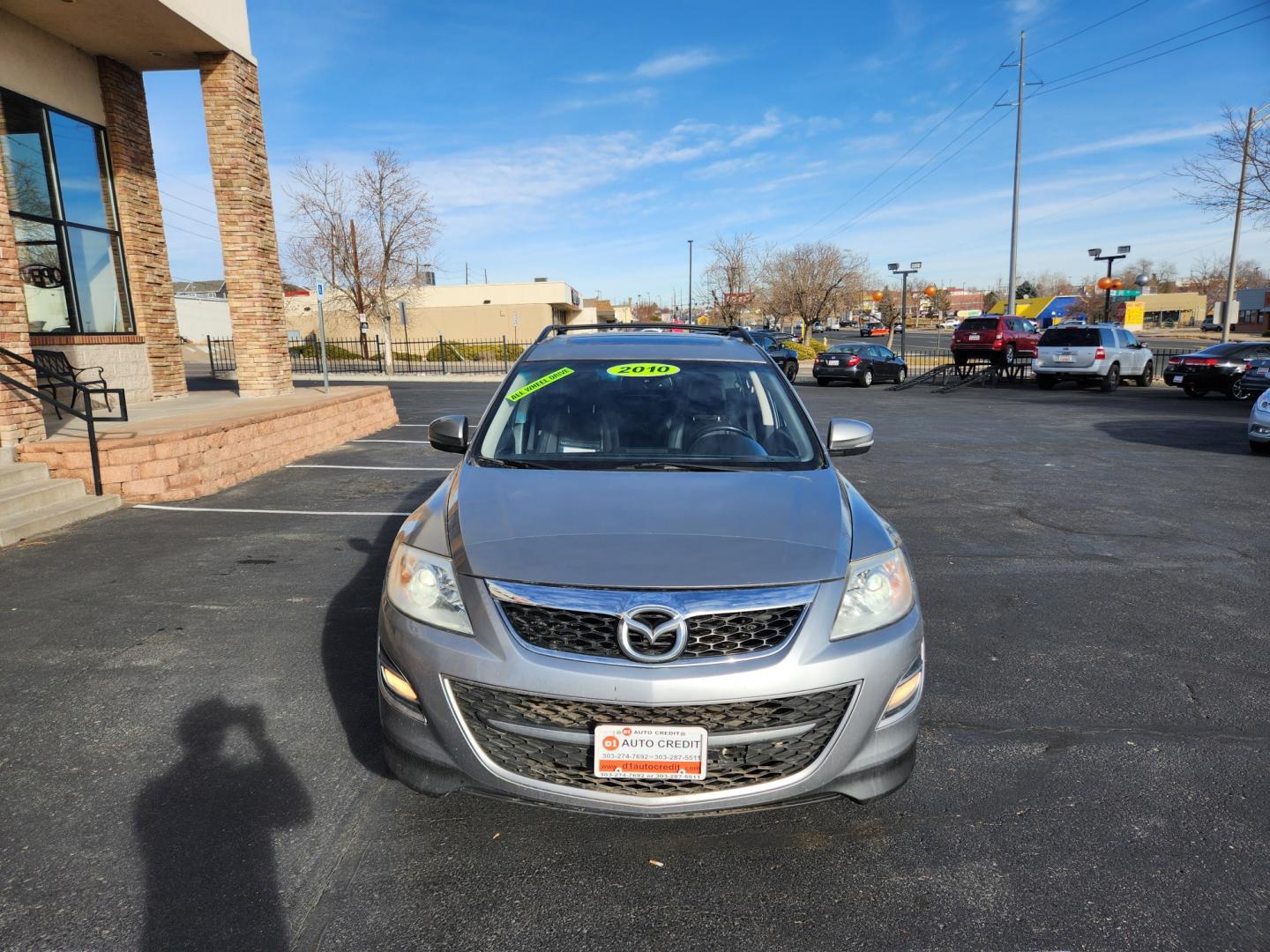 2010 Liquid Silver Metallic /Black Mazda CX-9 Grand Touring (JM3TB3MA6A0) with an 3.7L V6 DOHC 24V engine, Automatic transmission, located at 10890 W. Colfax Ave., Lakewood, CO, 80215, (303) 274-7692, 39.739914, -105.120132 - 2010 Mazda CX-9<br><br>D1 Auto NEVER charges dealer fees! All cars have clean titles and have been inspected for mechanical issues. We have financing for everyone. Good credit, bad credit, first time buyers.<br><br>Please call Lakewood Location 303-274-7692 or Thornton 303-287-5511 to schedule a tes - Photo#2